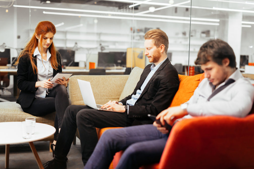 Business people conversation with technology at hand. Exchange of new ideas and brainstorming between colleagues